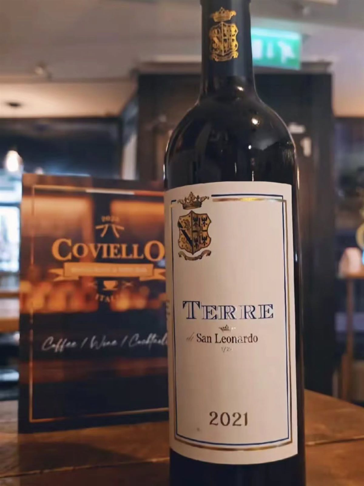 A bottle of Terre di San Leonardo 2021 red wine standing on a table in the restaurant